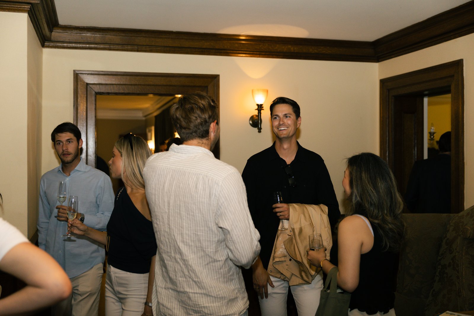 A candid moment among guests during the evening